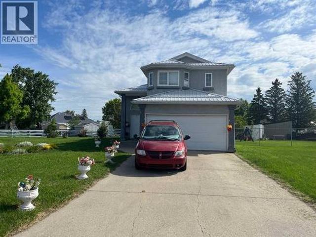 House for sale in Raymond, Alberta