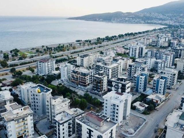 Kum, Finike içerisinde satılık mülk