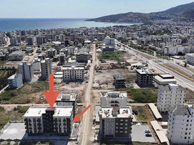 Kum, Finike içerisinde satılık mülk