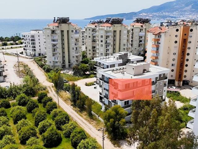 Kum, Finike içerisinde satılık mülk