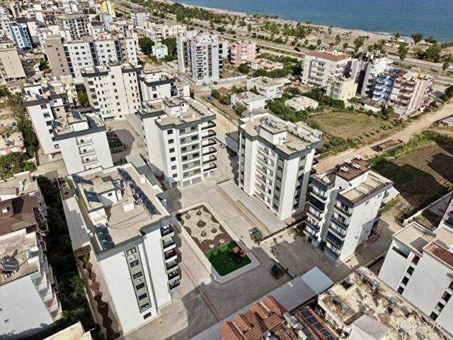 Kum, Finike içerisinde satılık mülk