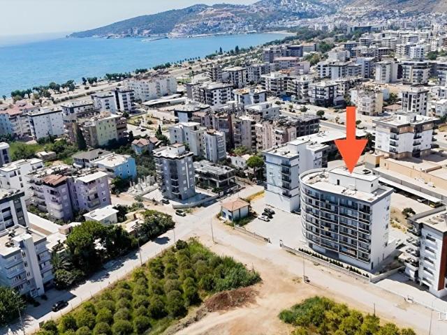 Kum, Finike içerisinde satılık mülk