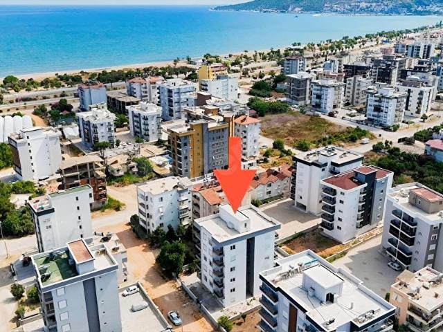 Kum, Finike içerisinde satılık mülk