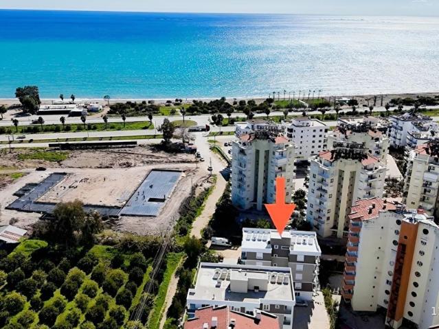 Kum, Finike içerisinde satılık mülk