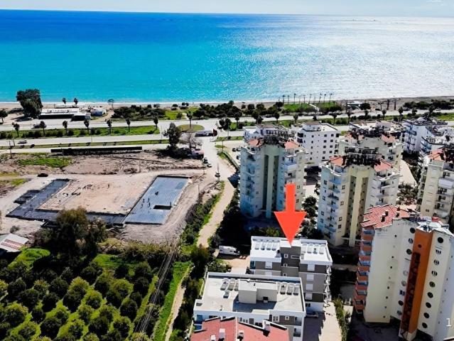 Kum, Finike içerisinde satılık mülk