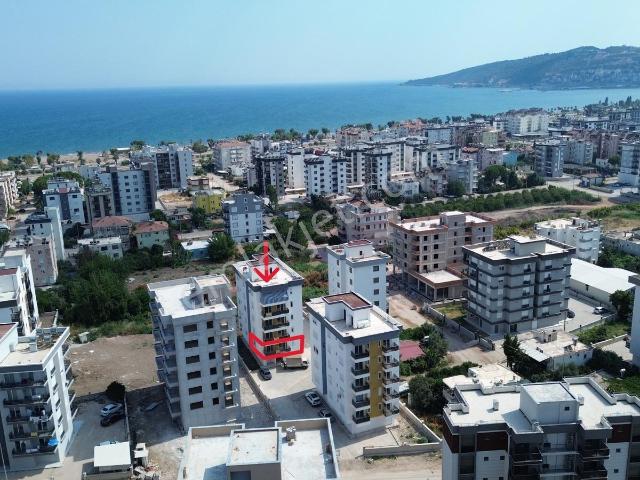 Kum, Finike içerisinde satılık mülk