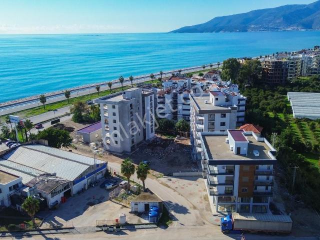 Kum, Finike içerisinde satılık mülk