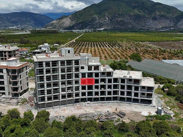 Kum, Finike içerisinde satılık mülk