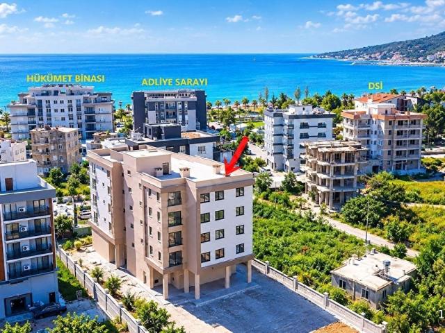 Kum, Finike içerisinde satılık mülk