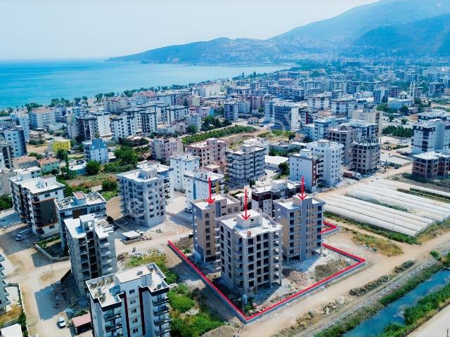 Kum, Finike içerisinde satılık mülk