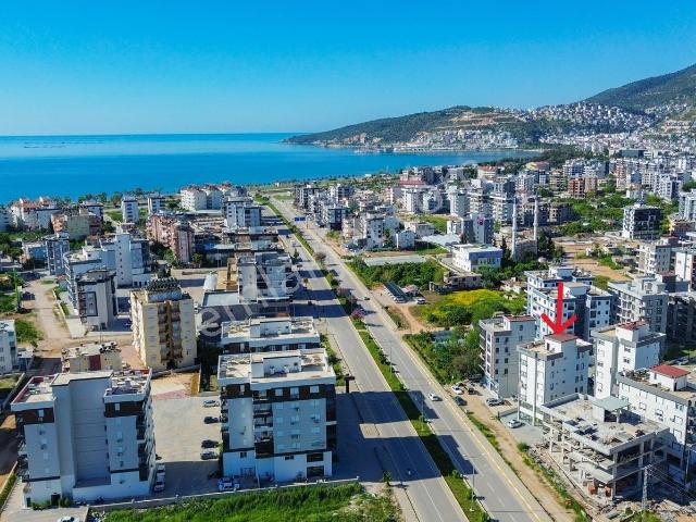Kum, Finike içerisinde satılık mülk
