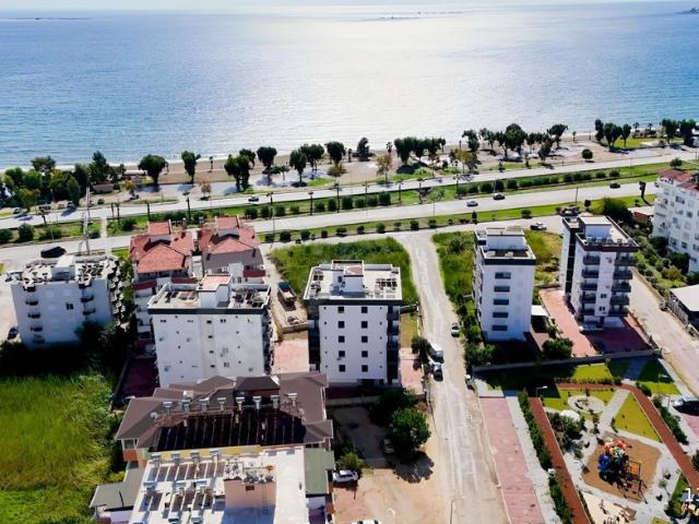 Kum, Finike içerisinde satılık mülk