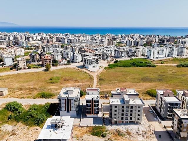 Kum, Finike içerisinde satılık mülk