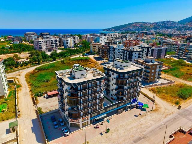 Kum, Finike içerisinde satılık mülk