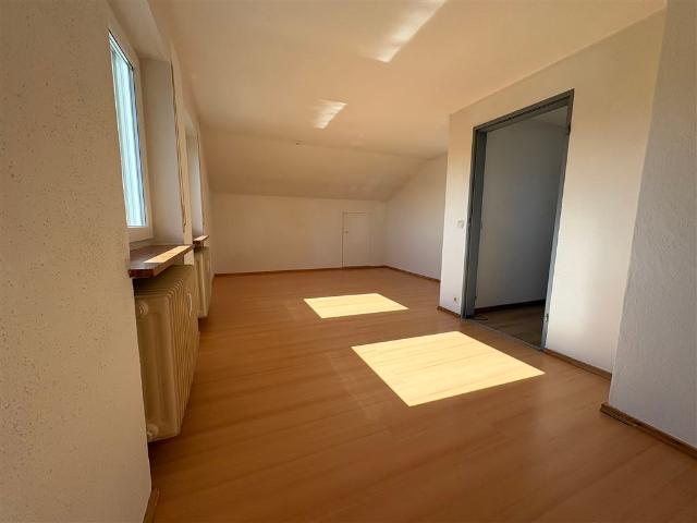 Dachgeschosswohnung kaufen in Raubling, Bayern