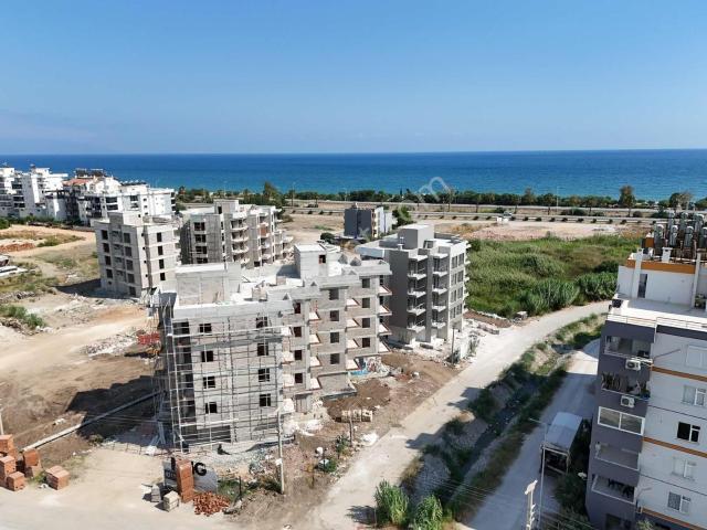Kum, Finike içerisinde satılık mülk