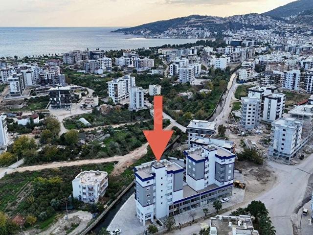 Kum, Finike içerisinde satılık mülk