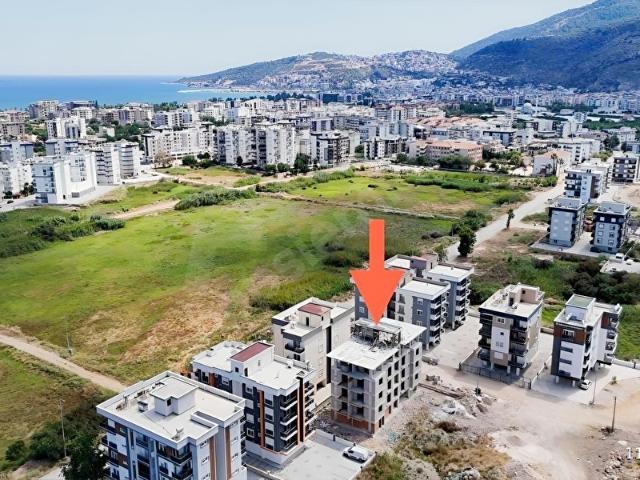 Kum, Finike içerisinde satılık mülk