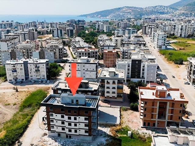 Kum, Finike içerisinde satılık mülk