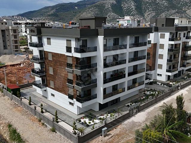 Kum, Finike içerisinde satılık mülk
